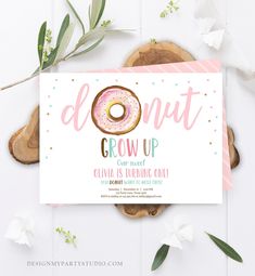 a donut grow up birthday party with pink and gold confetti on it