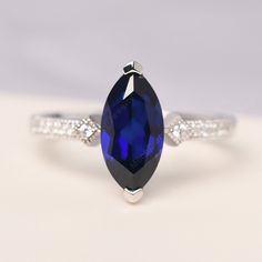 All HANDMADE ITEMS SHIP IN APPROX 8 DAYS Main Stone: Lab sapphire Main Stone Size: Marquise cut 6 mm x 12 mm Main Stone Weight: 2.19 carat Side Stone: CZ Height From The Ring Setting Bottom(to gemstone top): about 5.95 mm Width of Ring band Measure: gradually varied,about 2.1 mm Material: 925 Sterling Silver/14K White Gold/14K Yellow Gold/14k Rose Gold Engraved: Available For FreeNo more than 13 letters) Customized:Of course! Tell me what you want Includes With Order: All of my store items come Marquise Cut Sapphire Promise Ring, Gift Marquise Sapphire Ring, Marquise Sapphire Ring As Gift, Marquise Sapphire Birthstone Ring For Anniversary, Marquise Sapphire Ring Birthstone For Anniversary, Sapphire Promise Ring With Marquise Cut, Marquise Sapphire Promise Ring, Anniversary Sapphire Ring In Marquise Cut, Marquise Sapphire Ring In White Gold