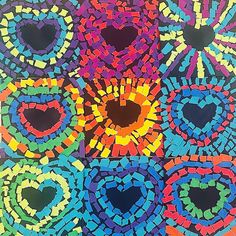 an art project with many different colors and shapes in the shape of heart shaped holes