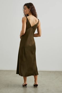 Sometimes you’re looking for something a little more structured than a simple slip dress, that’s where the Viviana comes in. Cut on the bias from a supple satin back crepe for a flowing silhouette, this dress features a v-neckline with a centerfront twist and center-front skirt.55% Rayon | 45% Viscose.Imported. Recommend ordering true to size.Front Body Length: 27 1/2" (Measured from Small) Dry clean only. Simple Slip Dress, Denim Sweater Jacket, Bias Cut Dress, Nye Outfits, Fall Denim, Denim Sweater, Ribbed Knit Dress, Cellulose Acetate, Flowing Skirt