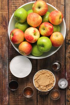 apples and other ingredients in bowls on a wooden table