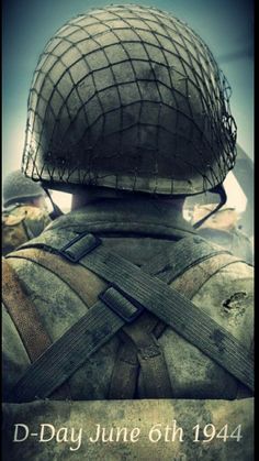 the back of a soldier's head with words on it that read d - day june 6th, 1940