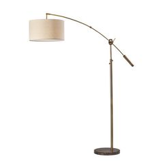 a floor lamp with a white shade on it