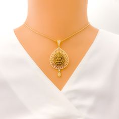 Embrace luxury with our Impressive Lakshmi 22k Gold CZ Pendant Set. Crafted from 14.5g of pure 22k gold, adorned with dazzling Cubic Zirconia. The pendant boasts a 2.2" length, complemented by matching 1" earrings with secure screw backs. Elevate your style with this exquisite 3-piece set. PRODUCT DETAILS Gold Purity(karat): 22k Item Weight(grams): 14.5 Item Finish: Yellow Gold Stone: Cubic Zirconia Pendant Length: 2.2" Matching Earrings: Included Earring Length: 1" Earring Post: Screw Back Numb Festive Gold Diamond Temple Necklace, Gold Diamond Temple Necklace Gift, Gold Diamond Temple Necklace For Gift, Elegant 22k Gold Temple Necklace For Puja, Traditional Gold Necklaces With Diamond Accents, Gold Necklaces With Intricate Designs In Cubic Zirconia, Gold Necklaces With Intricate American Diamond Design, Earring Post, Cz Pendant