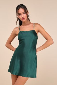 Romantic and special moments alike will been even more memorable with the Lulus Sincerest Elegance Emerald Satin Cowl Back Bow Mini Dress! This sleek satin dress boasts a subtle, slip-style silhouette with a sleeveless bodice, a straight neckline, and adjustable spaghetti straps. A wide strap features a trendy bow with long tails atop a draping cowl back, while a flirty mini hem completes the sensational design. Hidden side zipper/clasp. Fit: This garment fits true to size. Length: Mid-thigh. Si Green Wedding Guest Dresses, Cowl Back Dress, Bow Mini Dress, Trendy Bows, Adhesive Bra, Straight Neckline, Dress Satin, Satin Mini Dress, Satin Wedding