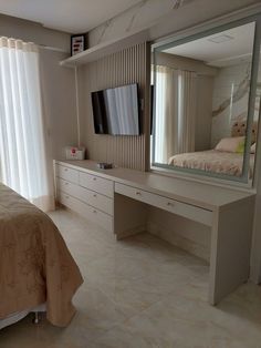 a bedroom with a large mirror on the wall