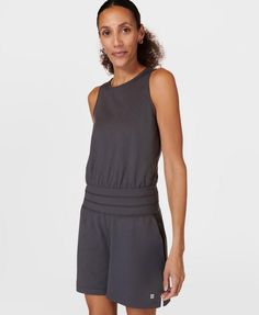 Our new romper for low-impact workouts. Updated 85% recycled fabric is ultra-soft, smooth and sweat-wicking. Slim fit top leads down to a relaxed pair of shorts with two pockets. Deep, fitted waistband that moves with you. Keyhole opening at back. Inseam length: 12.5cm / 5". Model wears size S and is 175cm/5'7" tall. Style Code: SB9839Colour: Urban Grey Summer Athleisure Activewear For Loungewear, Sleeveless Moisture-wicking Activewear For Loungewear, Moisture-wicking Sleeveless Activewear, Sleeveless Relaxed Fit Activewear For Yoga, Relaxed Fit Sleeveless Yoga Activewear, Relaxed Fit Sleeveless Activewear For Yoga, Versatile Sleeveless Activewear For Loungewear, Versatile Spring Activewear For Relaxation, Casual Sleeveless Activewear For Relaxation