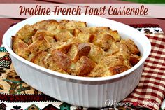 a casserole dish with bread in it on a red and white checkered table cloth