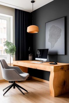 a desk with a laptop computer on top of it next to a chair and potted plant