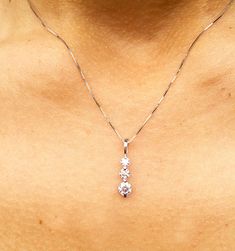 "14K WHITE GOLD, 0.75CTW ROUND CUT FOREVER ONE MOISSANITE, PRONG SET THREE STONE STYLE PENDENT THIS IS A VERY ELEGANT PIECE WITH THREE MAIN STONES (0.30,0.20,0.10CT EACH) THIS NECKLACE INCLUDES AN 18\" WHITE GOLD CHAIN Total weight is 0.75ct. DIAMONDS SPECIFICATIONS Metal : 14k Solid White Gold Stone Weight: 0.75CT, (4.5MM,4MM,3.5MM) Stone Shape: Round Stone Clarity: VVS Stone Color: D-E-F, FOREVER ONE MOISSANITE Certificate/Appraisal: Included Retail Appraisal Value: $1,500.00 * Larger/Smaller Wedding Pendant, Heirlooms Jewelry, Halo Earrings, Forever One Moissanite, White Gold Chains, Pendent Necklace, White Gold Wedding, Style Wedding, Diamond Stone