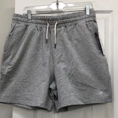 New Men’s Hodo Spirts Shorts. Grey In Color Size Large. One Zipper Side Pocket And Back Pocket. One Open Pocket Casual Jogging Shorts With Pockets, Casual Athletic Shorts With Pockets For Jogging, Casual Relaxed Fit Jogging Shorts, Casual Shorts With Built-in Shorts For Light Sports, Casual Athletic Shorts With Pockets For Sports Season, Casual Athletic Shorts For Light Sports, Casual Go-dry Shorts For Jogging, Casual Athletic Shorts For Jogging, Casual Shorts For Light Sports Season