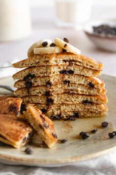 a stack of pancakes on a plate with chocolate chips