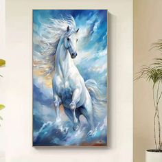 a painting of a white horse running in the clouds on a wall above a potted plant