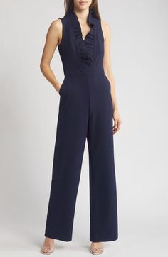 A frilled neckline adds festive flair to a one-and-done jumpsuit painted in a classic shade of navy blue. 59 1/2" length; 31" inseam; 22 1/2" leg opening (size 8) Hidden back-zip closure V-neck Sleeveless Partially lined 97% polyester, 3% spandex Hand wash, dry flat Imported Elegant Blue Jumpsuits And Rompers With Ruffles, Sleeveless Ruffled Jumpsuits For Formal Occasions, Formal Sleeveless Ruffled Jumpsuit, Formal Sleeveless Ruffled Jumpsuits And Rompers, Elegant Workwear Jumpsuits And Rompers With Ruffles, Ruffled Jumpsuits And Rompers For Work, Elegant Fitted Navy Jumpsuit, Navy Fitted Elegant Jumpsuit, Elegant Fitted Navy Jumpsuits And Rompers