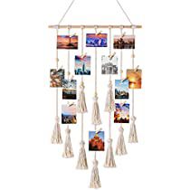 a wind chime with pictures and tassels hanging from it