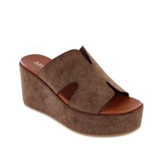 Mia-Reta Wedge Sandal The Mia Reta wedge sandal can be a great addition to your city-chic or laidback spring-summer look. Burnished suede construction gives a fashionable appeal to the platform slide, detailed with neat cutouts. A signature contoured footbed offers impressive comfort. Chic Brown Platform Slippers For Spring, Brown Wedge Heel Platform Slippers For Beach, Brown Cushioned Platform Slippers For Summer, Brown Platform Slippers With Cushioned Footbed For Summer, Suede Wedge Sandals With Round Toe For Spring, Spring Suede Wedge Sandals With Round Toe, Brown Summer Platform Slippers For Vacation, Summer Suede Open Toe Platform Slippers, Summer Open Toe Suede Platform Slippers