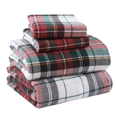 four plaid blankets stacked on top of each other