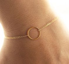 "Dainty Gold Eternity Bracelet♥ The most simple & delicate everyday bracelet. A very dainty eternity ring (24kt gold dipped sterling silver, 12mm) floats amongst two layers of the most dainty & shimmering gold filled chain. Bracelet is completed with a round spring clasp. ★★Need help with your bracelet size? Please measure your wrist, and add 1/2 - 3/4 of an inch for a comfortable fit! Standard size is 7 inches ♥Brides♥ Please contact me for a custom listing if you would like to purchase Delicate Bracelets With Simple Round Design, Dainty Adjustable Chain Bracelet For Bridesmaid, Delicate Round Bracelets With Simple Design, Dainty Round Bracelet For Bridesmaid Gift, Minimalist Bracelets For Bridesmaid Gift, Minimalist Rose Gold Bracelet With Adjustable Length, Dainty Gold-tone Metal Bracelets, Dainty Rose Gold Bracelet, 14k Gold Filled, Adjustable Dainty Circle Bracelets