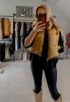 This cropped Camel Puffer Vest is perfect for chilly days. With a high collar, cinched hem, adjustable elastic toggle at back, and two cozy pockets, you'll stay warm and comfortable. The neutral color adds versatility to your everyday wardrobe. Pair with jeans and a top, with sweats, or over a fall dress for added warmth and style! Order your normal size or size up for larger fit. I'm shown wearing a medium. Fall Dress, Camel Color, Puffer Vest, Neutral Color, Everyday Wardrobe, Fall Dresses, High Collar, Neutral Colors, Stay Warm