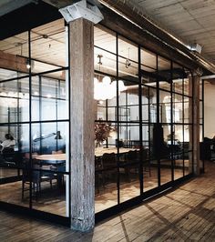 an open room with glass walls and wooden floors is seen on the instagram page