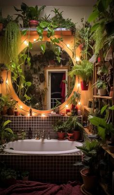 a bathtub filled with lots of plants next to a mirror