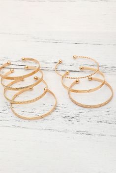 Add some bold flair to your jewelry collection with our Gold 7 pcs Textured Bracelet Set! Each piece features unique textured designs that give off a luxurious and high-end vibe. Perfect for adding a touch of elegance to any outfit. Pre-order now! Material:Alloy Textured Bracelet, Gold Bangle Set, Bracelet Sets, Gold Bracelet Set, Open Bangle, Gold Alloys, Textured Design, Outfit Making, Gold Bangle