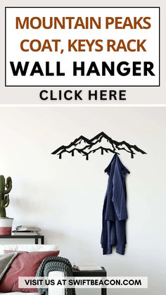 a wall hanger with mountains on it and the words mountain peaks coat keys rack