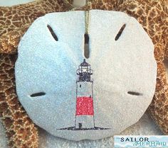 a stuffed animal with a red and white lighthouse on it's face is shown