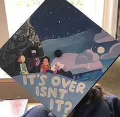 a child wearing a graduation cap that says it's over isn't it?