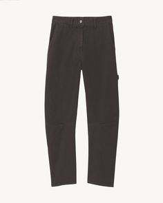 The Carpenter Pant is an oversized, wide-leg cotton trouser. It features a button closure with zip fly, two slash pockets at the front, classic utilitarian pocket details and a hammer loop on the side.