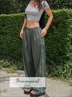 Style: Casual Waist Type: MID Decoration: Side Stripe Decoration: NONE Fabric Type: Broadcloth Pattern Type: striped Pant Style: Cargo Pants Material: Polyester Fit Type: LOOSE Length: Full Length Season: Summer Place Of Origin: China (Mainland) Closure Type: Elastic Waist Gender: WOMEN Front Style: Pleated 100% PolyesterSize TableS : Waist 64cm(25.2") Hip 118cm(46.5") Thigh 73cm(28.7") Length 104cm(40.9") M : Waist 68cm(26.8") Hip 122cm(48") Thigh 75cm(29.5") Length 105cm(41.3") L : Waist 72cm( Sporty Baggy Parachute Pants For Summer, Sporty Trousers For Summer, Sporty Summer Trousers, High Waist Sporty Sweatpants For Summer, Sporty Long Pants For Summer, Sporty Wide Leg Parachute Pants For Summer, Sporty Parachute Trousers For Summer, Summer Athleisure Parachute Trousers, Summer Athleisure Parachute Pants