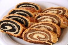 a white plate topped with lots of different types of pastries