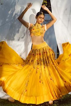 Yellow lehenga highlighted with zardozi and  resham floral embroidery. Comes with raw silk blouse and dupatta.
Components:3
Pattern:Embroidered
Type of Work:Floral
Neckline:Boat
Sleeve Length:Half
Fabric:Blouse and Lehenga: Raw Silk; Dupatta: Silk Georgette
Color:Yellow
Other Details:
Zardozi, dabka, nakshi, resham and mukaish embroidery
Embroidered blouse
Cutwork neckline and hem
Occasion:Mehendi and Haldi, Sangeet - Aza Fashions Mukaish Embroidery, Haldi Outfits, Haldi Outfit, Yellow Lehenga, Party Wear Lehenga Choli, Gaun Fashion, Embroidered Lehenga, Ghagra Choli, Indian Lehenga