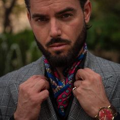 This neckerchief can effortlessly shift your style, whether you're going for a timelessly classic look or something a bit more rakish.The rich medallion pattern in olive, navy, and light blue against a deep red background takes inspiration from the charm of Tuscany’s cobblestone streets.Crafted from luxurious silk twill—a must-have accessory for any man who appreciates refined elegance. Details The classic neckerchief size: Approx. 27" x 27" (70 x 70cm). A comfortably large size that fits most m Men Neck Scarf, Men’s Neckerchief Outfit, Men Silk Scarf Style, Scarf Tied Around Neck Men, Men’s Silk Scarf Fashion, Bandana Scarf, Cowboy Style, Hand Roll, Scarf Men