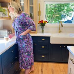 Start your morning off right! Slip into our bright & cheery robe while you prepare for your day. This 100% cotton robe features a vibrant Indian block print, in a rich iris purple, patterned with a blue blossoming floral, trimmed in white piping. Other details include 3/4 length sleeves, pockets and tying-sash. One size fits most. Details: Made in India Fabric: 100% cotton 3/4 length sleeves Pockets Includes tying-sash Purple Cotton Sleepwear For Relaxation, Purple Spring Sleepwear For Home, Spring Purple Home Sleepwear, Purple Floral Print Sleepwear For Loungewear, Purple Floral Print Sleepwear, Iris Purple, India Fabric, Printed Kimono, Indian Block Print