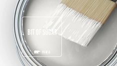 a paint can with a brush in it and the words bit of sugar on top