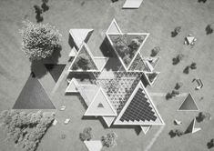 an aerial view of trees and buildings in the shape of triangulars with geometric shapes