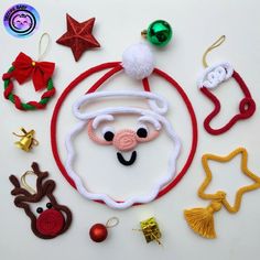 various christmas ornaments are arranged on a white surface