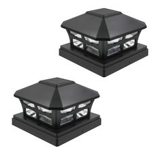 two black solar powered outdoor lights on top of each other, one is turned on and the other is off