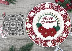 a christmas plate with poinsettis and the words happy christmas written on it