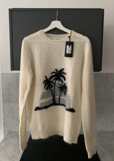 Saint Laurent Paris Palm tree intarsia mohair sweater knitted jumper cream white size xl CONDITION: _Brand new with tags _Always 100% authentic  PAYMENT: _I accept Paypal only. SHIPPING:  _ Package will be neatly shipped with outer box _ Shipping with delivery confirmation _ Item will be shipped within 48 hrs after payment is received. FREE shipping within the U.S continent  IG-kawsn3ff3ct Mohair Sweater Knit, Saint Laurent Paris, Mohair Sweater, Men's Knit, Knitted Jumper, Knit Jumper, Cream White, Palm Tree, Men's Fashion