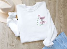 Embroidered Merry & Bright Crewneck, Embroidered Christmas Sweatshirt For Family is here to be the best gift for your friends and family with all the cool designs and styles they come in. If you have any additional requests or questions please send me a message and I will be happy to be of help Unisex Woolen Sweater Model: Sweater Unisex Fit: Classic Fit Sleeve type: Long sleeves Each all-over printed sweater is constructed from premium polyester wool that is ultra-soft and in White Tops With Custom Embroidery For Christmas, Model Sweater, Sweater Designs, Woolen Sweater, Minimal Christmas, Embroidery Sweater, Embroidered Christmas, Christmas Catalogs, Embroidered Crewneck