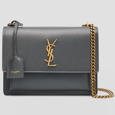 Details Saint Laurent "Sunset" Shoulder Bag In Bark-Effect Leather, Faux Leather (Polyurethane), And Suede Features Signature Ysl Logo Lettering Sliding Chain Shoulder Strap Can Be Doubled; Logo Tag Flap Top With Magnetic Closure Exterior, One Slip Pouch Under Flap Bronze Hardware. Divided Interior; One Slip Pocket Approx. 6.3"H X 8.7"W X 2.6"D Professional Cleaning Recommended Made In Italy Brand New Item. Dust Bag And Authentication Certificate Included. Comes From A Smoke Free And Pet Free Ho Ysl Star Bag, Ysl Sunset Bag, Ysl Crossbody, Ysl Crossbody Bag, Saint Laurent Purse, Ysl Bags, Ysl Logo, Bronze Hardware, Logo Tag