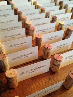 there are many wine corks with place cards on them