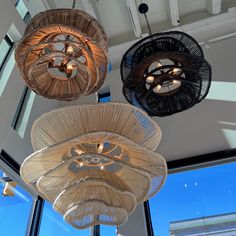 three circular lights hanging from the ceiling in a room