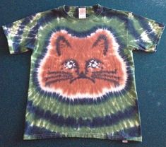 Custom made to order Cat tie dyed shirt. All of our shirts are 100% heavy weight cotton and the colors DO NOT fade! We have over 20 years experience in the tie dye business. We love it just as much today as we did 20 years ago!! We offer a variety of patterns and we take requests for stuff we don't already do. Contact us today and create your own one of a kind tie dye. We also offer wholesale pricing to business customers. Contact us today for wholesale pricing information. Last but not least we Cat Tie Dye, Earthy Tie Dye, Sunprinting Tshirt, Tye Dye Designs, Tye Dye Ideas, Tye Dye Clothes, Tie Dye Business, Tie Dye Ideas, Aesthetic Clothes Vintage