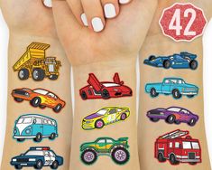 a woman's arm with different colored cars on it and the number 42 painted on her arm