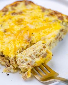 a piece of quiche on a plate with a fork