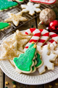 decorated christmas cookies on a white plate