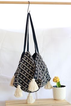 This handmade shoulder bag is a true piece of art, featuring intricate hand-stitching a unique bohemian design, and a four-sided (tetrahedral) base, giving it a distinct and geometric look. Crafted with care by our artisans. This bag is perfect for anyone who loves unique and beautiful accessories.  With its charming tassels and original design, this bag is sure to be a standout addition to any wardrobe. Unique Design: Every bag boasts a distinct pattern, with subtle variations in details, makin Recycled Jeans Bag, Artisan Bag, Beautiful Accessories, Market Bags, Recycled Jeans, Hobo Bags, Jeans Bag, Bohemian Design, Dark Blue Color